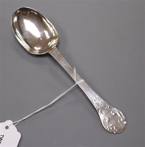 A provincial silver lace-back trefid spoon, 18th century, marked WB, the trefoil terminal pin-engraved verso with WG/WG/1702,